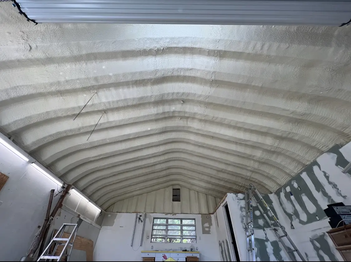 Spray polyurethane foam applied to the underside of a metal roof deck in McCook